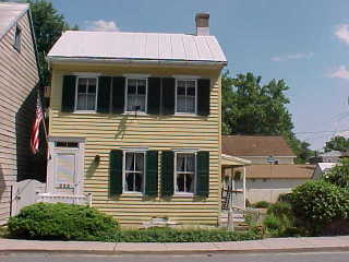 Chesapeake City cottage with grey panel coating