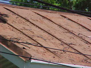 Closeup of panels for Roof Menders to apply preservation process using sealer for tin roofing