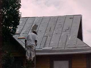 <br>
Crew chief inspecting work by his Roof Menders crew members