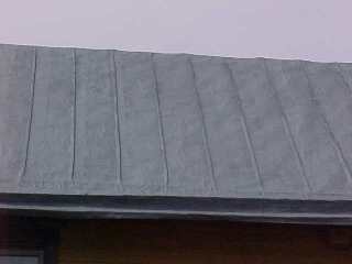 Roofing tin takes on the appearance of a traditional panel surface 