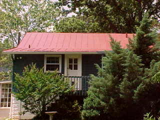 Back of cottage with tin roof sealer